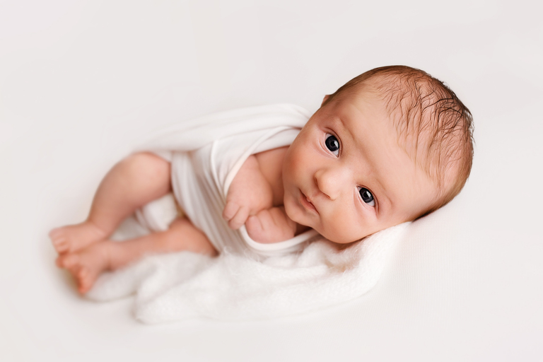 newborn baby on the white backdrop